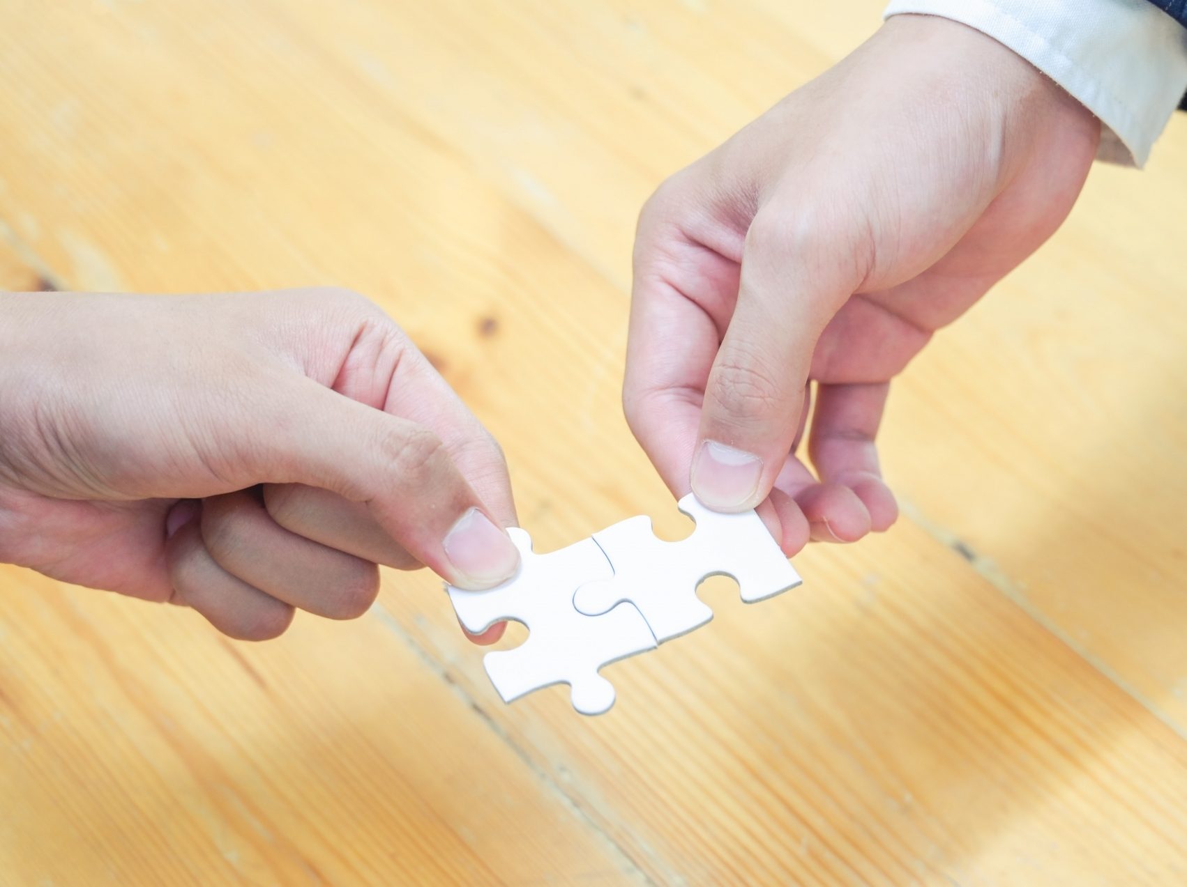 person-holding-white-jigsaw-puzzle-piece-3740403
